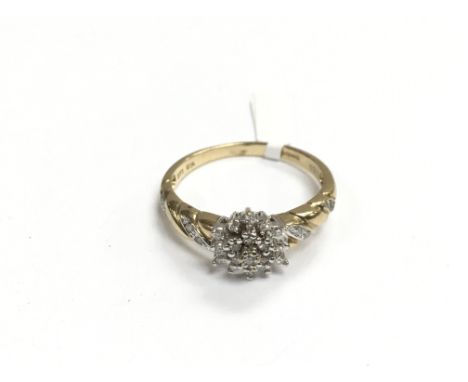 A 9ct gold three tier diamond set cluster ring with further diamonds to the shoulders, approx 3g and approx size S.