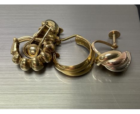 A pair of untested 18ct gold earrings, approx 12.3g, together with 2 odd 14ct gold earrings. Approx 4.5g.