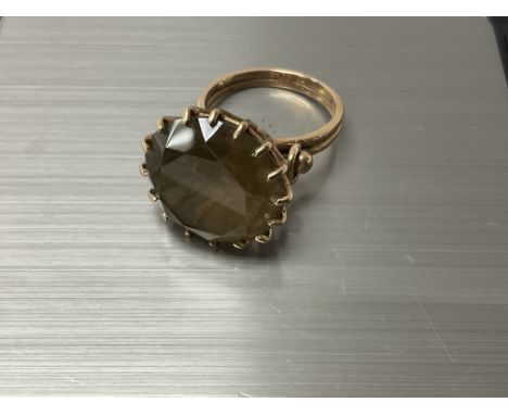 A large 9ct gold and Smokey quartz dress ring. N.