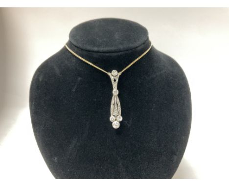 A 1920s 18ct and platinum pendant inset with approximately 1.75ct brilliant cut diamonds, with a later added 18ct yellow gold