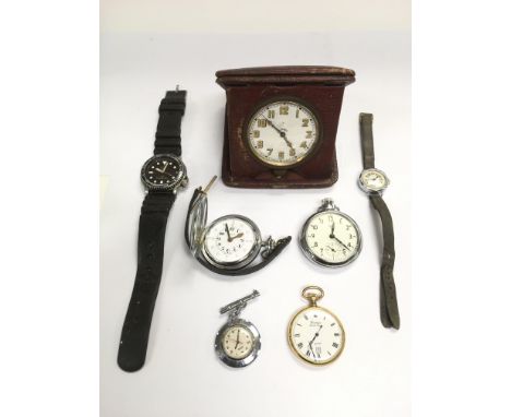 A small collection of button wind pocket watches and other watches.