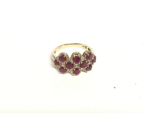 A 9ct gold ring set with multiple stones. Size Q and 3.50g total weight.