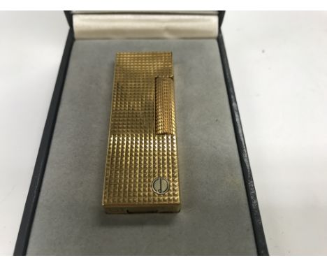 A boxed gold plated Dunhill lighter . NO RESERVE