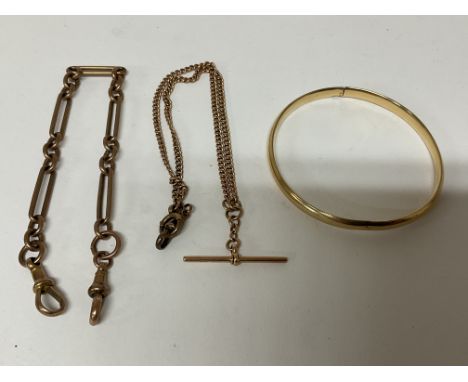 A 9ct gold Albert chain, a 15ct gold Albert chain and a 14ct gold bangle. Approx 32g.