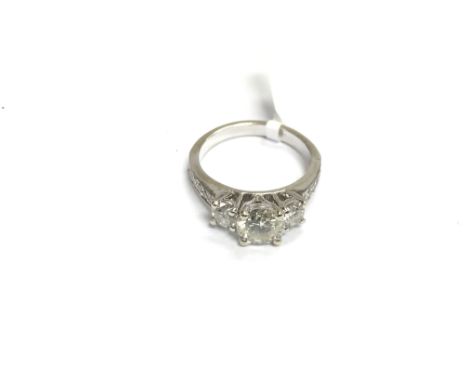 An 18ct white gold three stone diamond ring, centre stone approx 1ct, approx 4g and approx size K.