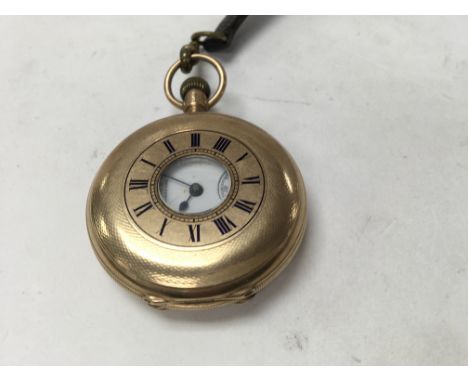 A gold plated half Hunter pocket watch .