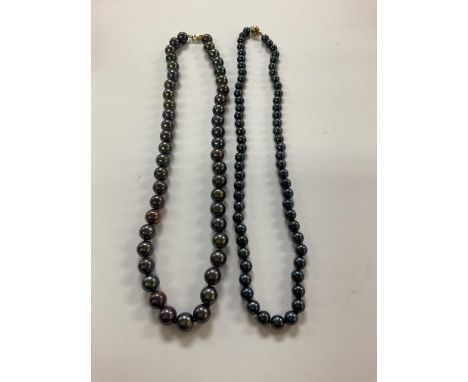 A 9ct gold and iridescent blue pearl necklace together with a 14ct yellow gold blue pearl necklace.
