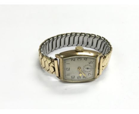 A vintage gents gold watch.
