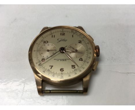 A Swiss gold wrist watch chronograph.