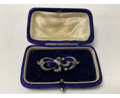 An Edwardian rose cut diamond and blue stone set brooch. Unmarked tested minimum 9ct gold.