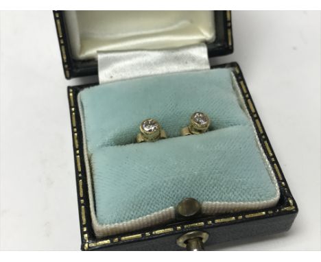 A pair of 18ct yellow gold diamond stud earrings, approx 10pts per stone.