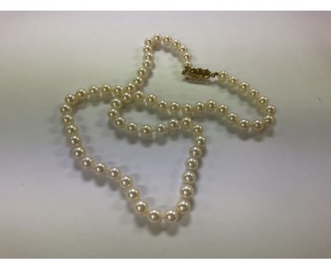 A 14ct gold and single row of pearls.