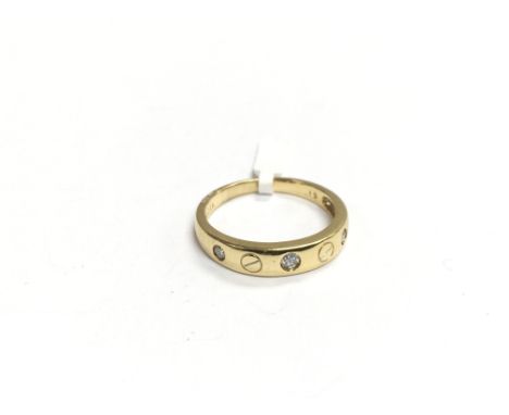 An 18ct gold Cartier style diamond ring, approx 4g and approx size R.