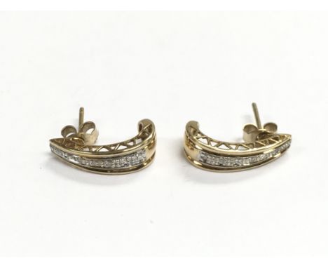 A pair of 9ct gold diamond set stud earrings, approx 2g.