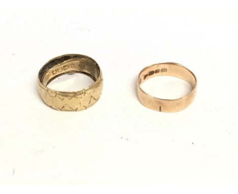 A 12ct gold ring weighting 2.23g and an 18ct weighing 2.16g