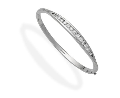 DIAMOND-SET BANGLE, 2011Set to the front with a graduated row of brilliant-cut diamonds, mounted in 18 carat gold, diamonds a