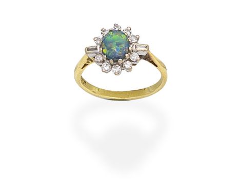 OPAL AND DIAMOND CLUSTER RINGThe oval opal cabochon within a single-cut diamond surround, between baguette-cut diamond should