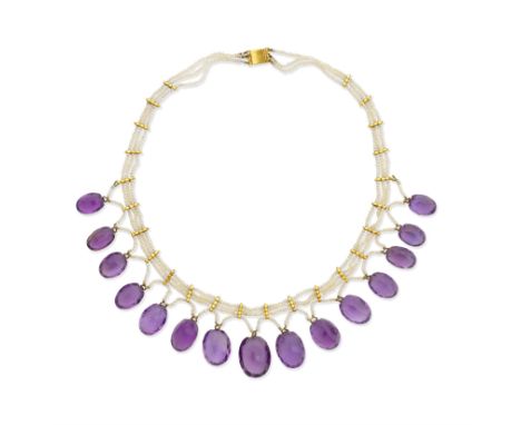 AMETHYST AND SEED PEARL FRINGE NECKLACEThe three-row seed pearl necklace, suspending an oval-cut amethyst fringe, length 40.5