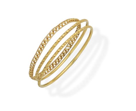 THREE BANGLESOf textured design, one bangle misshapen, inner circumference approx. 19.5cmFor further information on this lot 