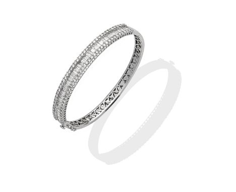 DIAMOND BANGLE, 2005The hinged bangle set to the front with baguette and brilliant-cut diamonds, mounted in 18 carat white go
