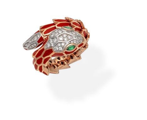 ENAMEL AND GEM-SET SNAKE RINGDesigned as a coiled snake with sprung structure, decorated with red enamel, the eyes set with m