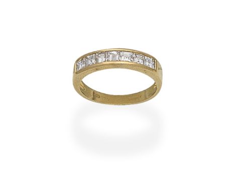 DIAMOND HALF ETERNITY RING, 1989Set with step-cut diamonds, mounted in 18 carat gold, London import mark,  ring size approx. 