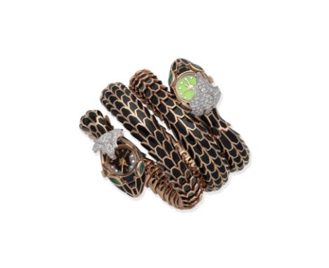 BLACK ENAMEL AND GEM-SET SNAKE BRACELET/WATCHDesigned as a coiled, double-headed snake with sprung structure, the body decora