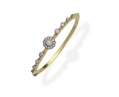 CULTURED PEARL AND DIAMOND BANGLE, CIRCA 1900Set with a 4.5mm cultured pearl within an old brilliant-cut diamond surround, th