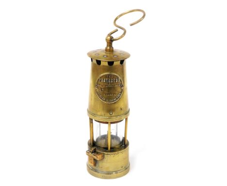 A Protector Lamp and Lighting Company brass miner's lamp, 27cm high. 