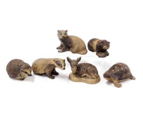 Six Poole buff pottery figures of animals, comprising two badgers, a guinea pig, a fawn, hedgehog and a tortoise. 