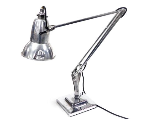 An Anglepoise model 1227 chrome and aluminum desk lamp, designed by Herbert Terry, raised on a stepped square base, (AF).&nbs