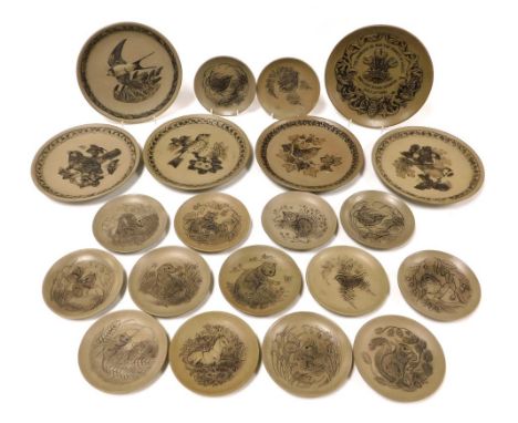 A group of Poole pottery buff stoneware plates, decorated in the Garden Birds series, together with similar dishes decorated 