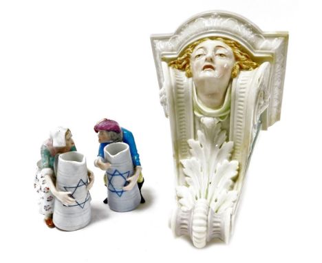 A late 19thC Royal Worcester porcelain wall bracket, modelled with the head of a lady above an acanthus leaf and scrolls, imp