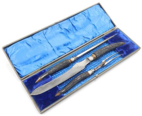A Victorian horn handled steel carving set, comprising fork, carving knife and steel, by Joseph Elliot &amp; Sons of Sheffiel