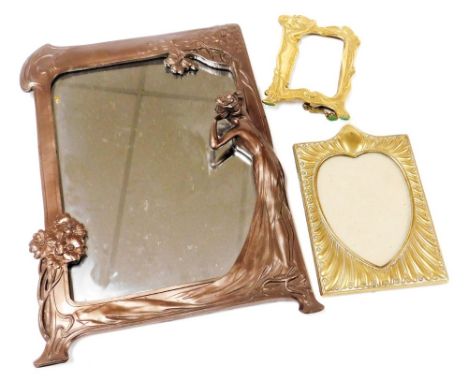 An Art Nouveau style bronzed plaster strut photograph frame, strut lacking, 36cm high, together with two brass strut photogra