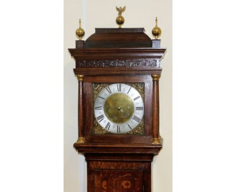 A Georgian oak longcase clock by Manister Baxter of St Neots, the square brass dial with rococo style spandrels, engraved cen