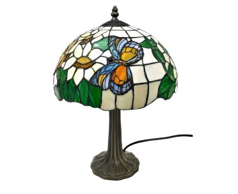 A Tiffany style table lamp, with an opaline glass shade decorated with butterflies and flowers, 46cm high.