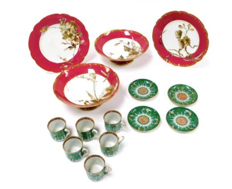 A Haviland and Company Limoges porcelain part dessert service, decorated with autumn leaves against a burgundy ground, gilt h