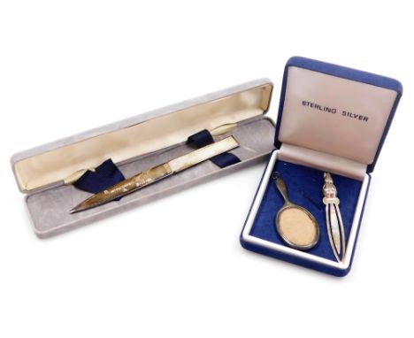 A silver paper knife, with an engine turned decorated handle, blade presentation engraved, cased, Birmingham 1990, together w