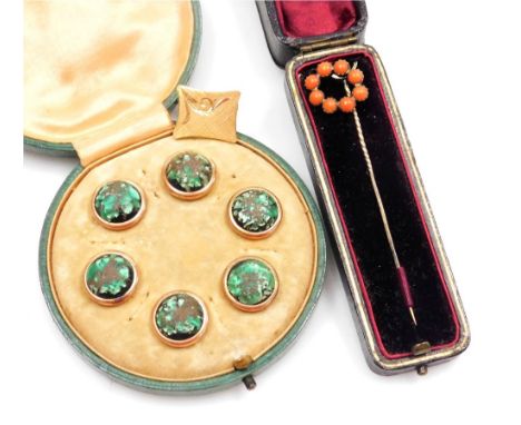 A gentleman's cuff link, foliate engraved, yellow metal, bears marks, 4.3g, together with a Victorian coral set stick pin, ca