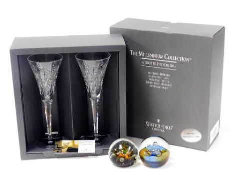 A pair of Waterford Millennium Collection crystal champagne flutes, a toast to the year 2000, boxed, together with a Caithnes