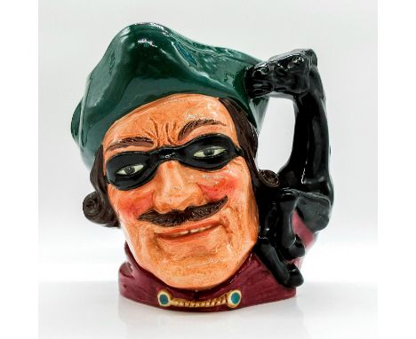 Style Two. Green tricorn, black mask over the eyes, red jacket.The first style of the Dick Turpin jug has the mask up on the 