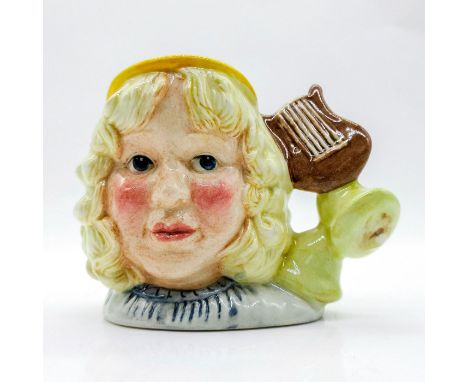 White, light brown, and yellow coloration.This jug was issued in the U.S.A. only, but made available to all members of the Ro