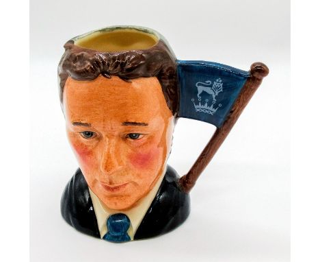 Small special edition signed jug in blue blazer yellow and light blue cravat with brown and gray hair. Glazed finish.Royal Do