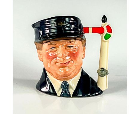 Black cap and coat; white shirt.Each jug in the Journey Through Britain series was given a specially designed backstamp relat