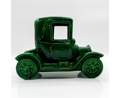 Glazed piece resembling original automobile considered to be first affordable car.Gold sticker stating Metlox Manufacturing C