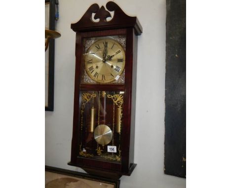 A late 20th century wall clock, in working order.