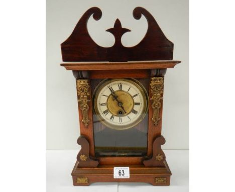 A late Victorian mantel clock in working order.