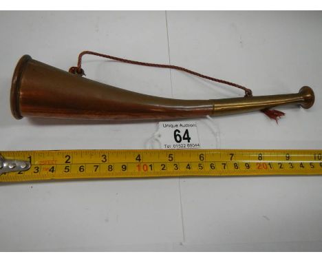 An old copper hunting horn in good condition.
