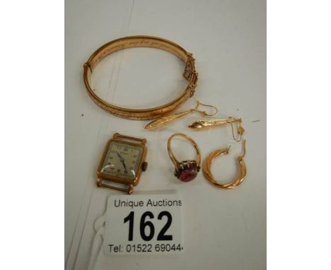 A mixed lot of gold items including ruby ring, earrings etc.,